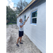 SPHA team members painting house.