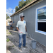 Michael Lundy, President and CEO of the SPHA, painting a Habitat for Humanity house.