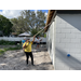 SPHA team members painting house.