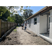 SPHA team members painting house.