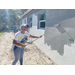 SPHA team member painting house.