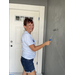 SPHA team member painting house.