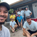 SPHA team smiling in front of Habitat for Humanity house with crew leaders.