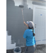 SPHA volunteer painting house.