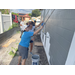 SPHA team members painting house.