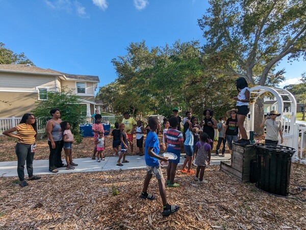 Group of people gathered at Jordan Park Community Garden.