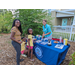 People at Tampa Bay Watch Discovery Center table.