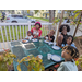 People eating pizza at Jordan Park Community Garden.