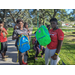 Kids holding new backpacks at Jordan Park Back to School Event 2023.