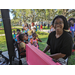 Woman smiling at Jordan Park Back to School Event 2023.