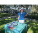 Woman standing by table at Jordan Park Back to School Event 2023.