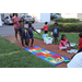 Kids playing hopscotch outside at Disston Place Apartments Back to School Event 2023.