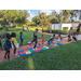 Group of children playing hopscotch outside on a sunny day at Disston Place Apartments Back to School Event 2023.