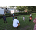United Way Suncoast team and children playing outside with bubbles at Disston Place Apartments Back to School Event 2023.