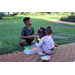 Children playing together outside at Disston Place Apartments.