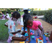 Children playing together outside at Disston Place Apartments Back to School Event 2023.