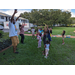 United Way Suncoast team and children dancing outside.