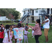 United Way Suncoast team and children dancing outside at Disston Place Apartments.