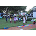 United Way Suncoast team and children dancing and a girl playing hopscotch at Disston Place Apartments Back to School Event 2023.