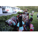 Children getting new backpacks at Disston Place Apartments Back to School Event 2023.