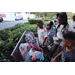 Children receiving backpacks at Disston Place Apartments Back to School Event 2023.