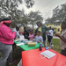 Families getting information at Very Merry Holiday Party 2023 in Jordan Park.