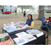 Woman sitting at table at Very Merry Holiday Party in Jordan Park.