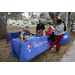 People by Pinellas Help Me Grow Florida table at Very Merry Holiday Party in Jordan Park.