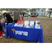 people by Year Up table at Very Merry Holiday Party in Jordan Park.