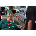 Woman getting her face painted at Very Merry Holiday Party in Jordan Park.