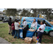 Tampa Bay Watch team sharing information with people at Very Merry Holiday Party in Jordan Park.