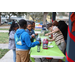 Children getting snow cones at Very Merry Holiday Party in Jordan Park.