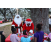 Mr. and Mrs. Santa Claus at Very Merry Holiday Party in Jordan Park.