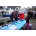 People getting hot cocoa at Very Merry Holiday Party in Jordan Park.