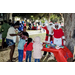 Santa Claus and Mrs. Claus waving at Very Merry Holiday Party 2023 in Jordan Park.
