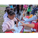 Children playing at Very Merry Holiday Party 2023.