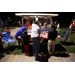 Man sitting and children drawing at red table at Very Merry Holiday Party 2023 in Jordan Park.