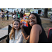 Girl getting her face painted and face painting artist smiling at Very Merry Holiday Party 2023.