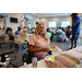 Woman getting food inside The Legacy at Jordan Park building during SPHA Winter Wonderland event.