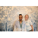 Two women in front of winter backdrop inside The Legacy at Jordan Park building during SPHA Winter Wonderland event.