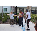 Residents and SPHA staff dancing outside of The Legacy at Jordan Park building in St. Petersburg during SPHA Winter Wonderland event on March 14th.
