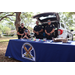 St. Petersburg Police Department officers smiling at the Spring Family Picnic event in Jordan Park on March 26, 2024.