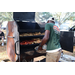 Cutting Edge Landscape &amp; Nursery preparing BBQ chicken and hotdogs at the Spring Family Picnic event in Jordan Park on March 26, 2024.