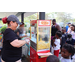 SPHA staff serving popcorn at the Spring Family Picnic event in Jordan Park on March 26, 2024.