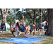 Children beginning to tree climb at the Spring Family Picnic event in Jordan Park on March 26, 2024.