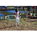 Young girl with face painted hula hooping at the Spring Family Picnic event in Jordan Park on March 26, 2024.