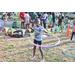 Young girl wearing light blue shirt hula hooping at the Spring Family Picnic event in Jordan Park on March 26, 2024.