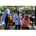 Three people dancing at the Spring Family Picnic event in Jordan Park on March 26, 2024.