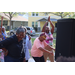People dancing and raising their arms at the Spring Family Picnic event in Jordan Park on March 26, 2024.