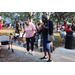 People on sidewalk at the Spring Family Picnic event in Jordan Park on March 26, 2024.